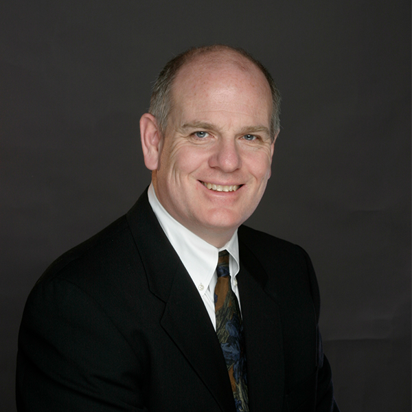 headshot of man looking at the camera