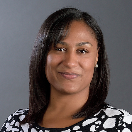 African American woman smiles at camera